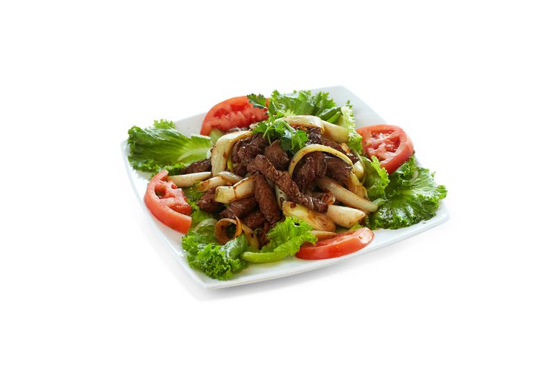Beef sauteed with tomato and onion.