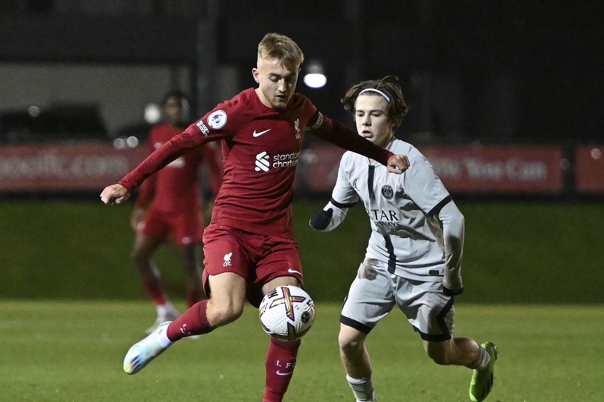Jake Cain of Liverpool and Etienne Michut of Paris Saint-Germain in action during the Premier League International Cup at AXA Training Centre on January 11, 2023 in Kirkby, England.