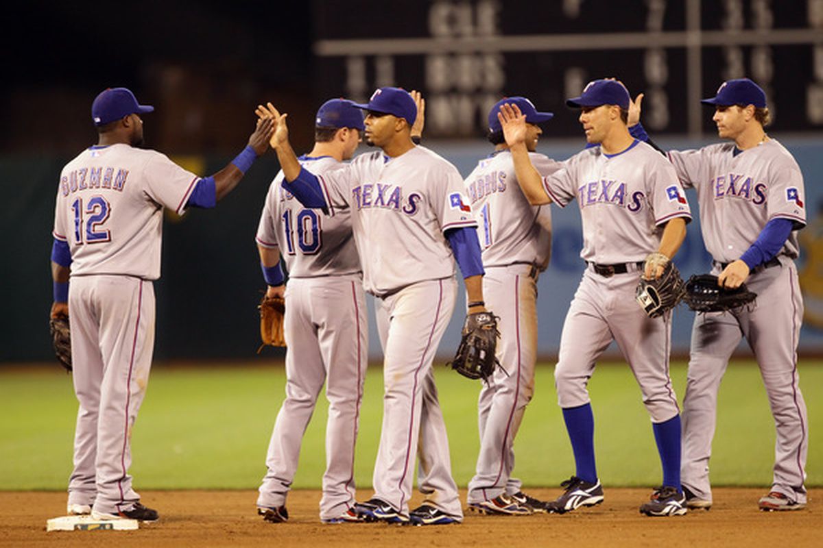 OAKLAND CA - AUGUST 06:  The Texas Rangers celebrate after they beat the Oakland Athletics 5-1 at the Oakland-Alameda County Coliseum on August 6 2010 in Oakland California.  (Photo by Ezra Shaw/Getty Images)