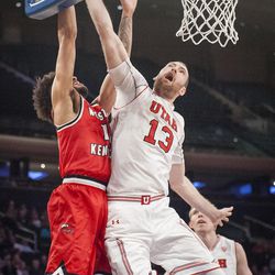 Utah Utes forward David Collette (13) blocks the shot of Western Kentucky Hilltoppers guard Darius Thompson (15) against the glass as the University of Utah Running Utes take on the Western Kentucky Hilltoppers in the semifinal round of the 2018 NIT in Madison Square Garden in New York City on