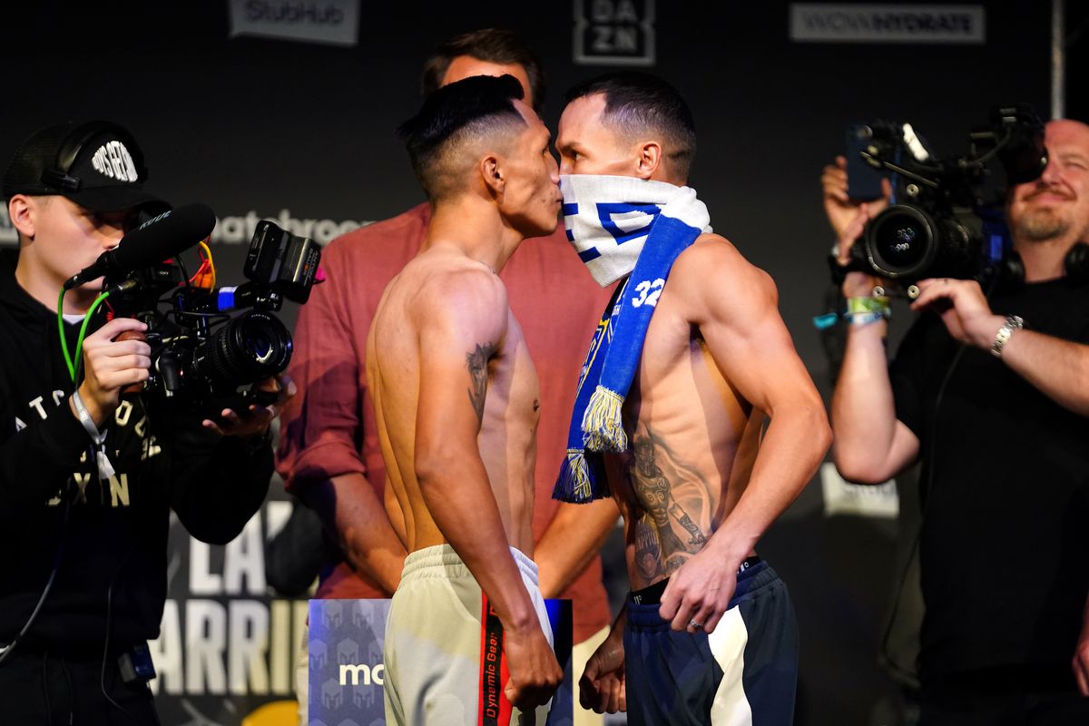 Josh Warrington (right) and Mauricio Lara during the weigh-in at the New Dock Hall, Leeds.