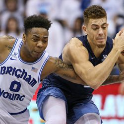 Brigham Young Cougars guard Jahshire Hardnett (0) and San Diego Toreros forward Isaiah Pineiro (0) chase a loose ball at the Marriott Center in Provo on Saturday, Jan. 20, 2018.