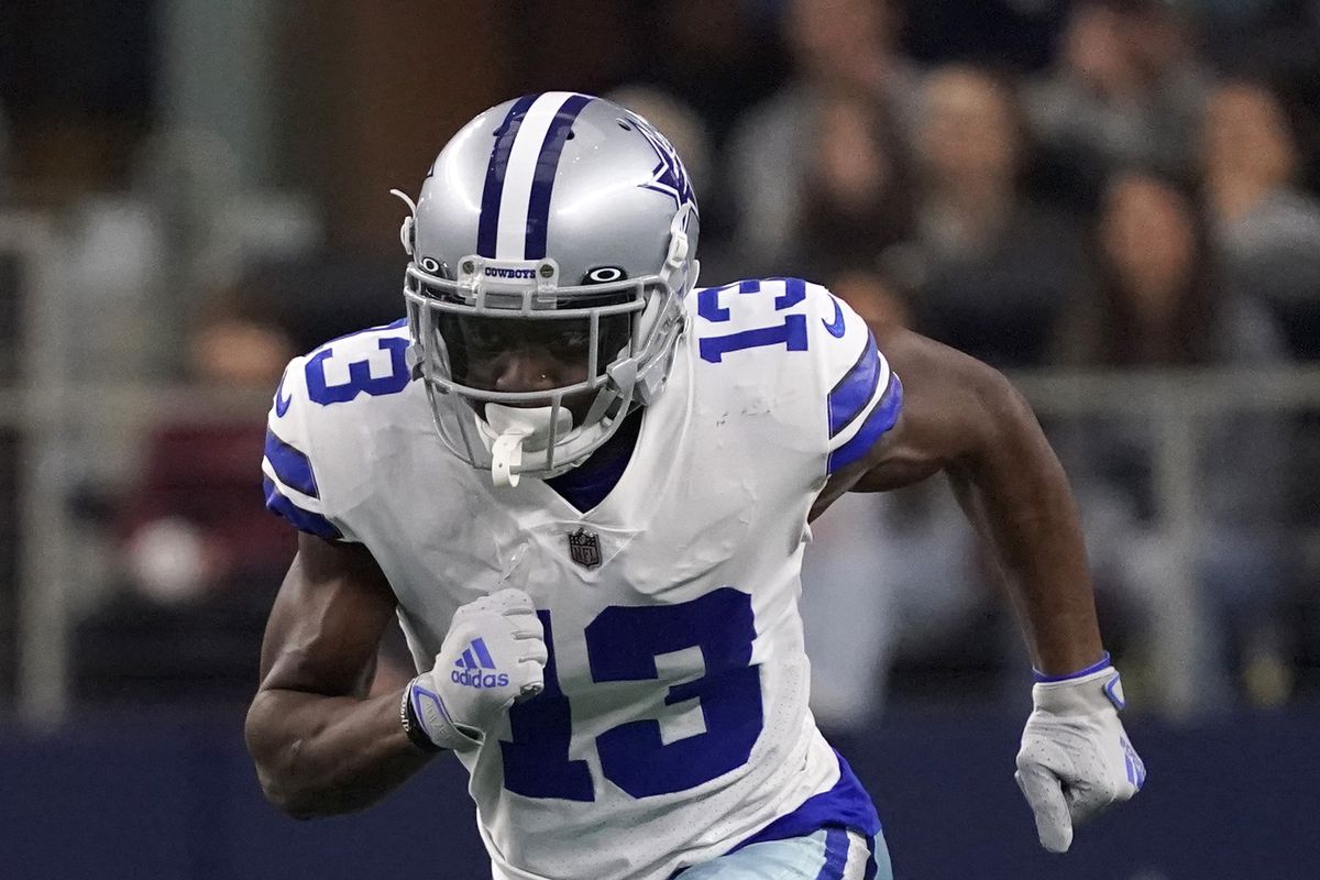 Michael Gallup #13 of the Dallas Cowboys runs during the first half of a game against the Houston Texans at AT&amp;T Stadium on December 11, 2022 in Arlington, Texas.