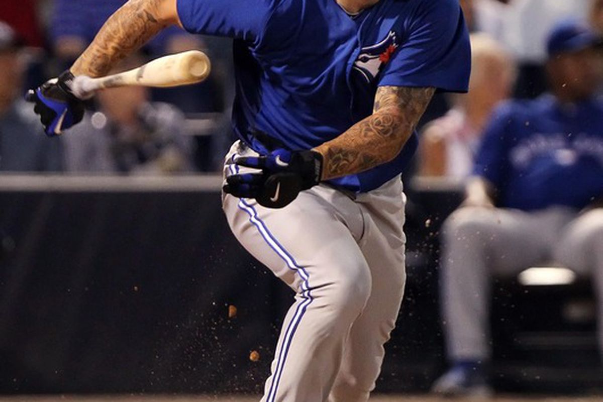 March 27, 2012; Tampa, FL, USA; Toronto Blue Jays third baseman Brett Lawrie (13) hits a ground rule double in the fourth inning against the New York Yankees at George M. Steinbrenner Field. Mandatory Credit: Kim Klement-US PRESSWIRE