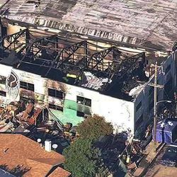 This Dec. 3, 2016 image from video provided by KGO-TV shows the Ghost Ship Warehouse after a fire that started late Friday swept through the Oakland, Calif., building. Dozens of people are confirmed dead with the toll expected to rise. (KGO-TV via AP)