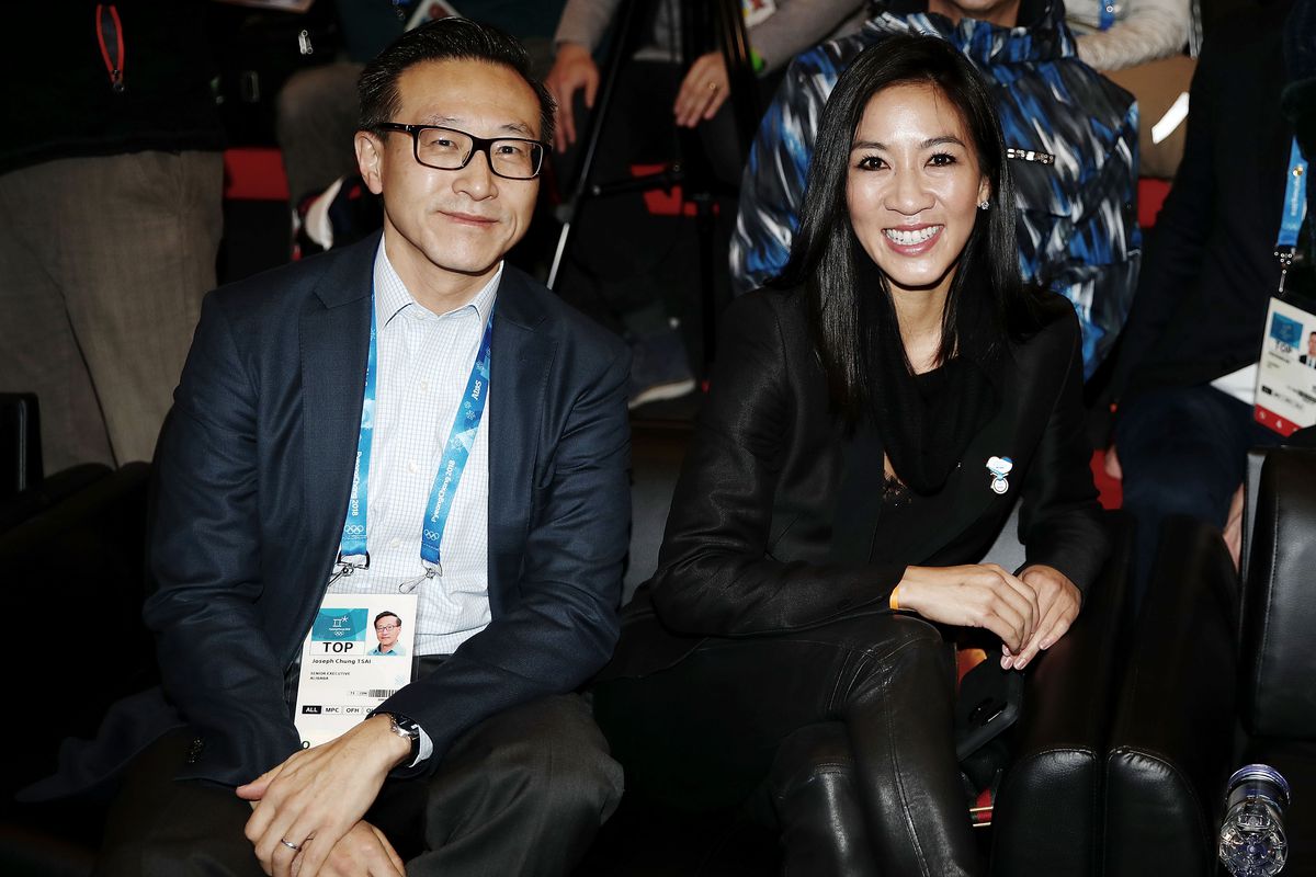 Alibaba co-founder and Executive Vice Chairman Joe Tsai, left, with Olympic figure skater Michelle Kwan