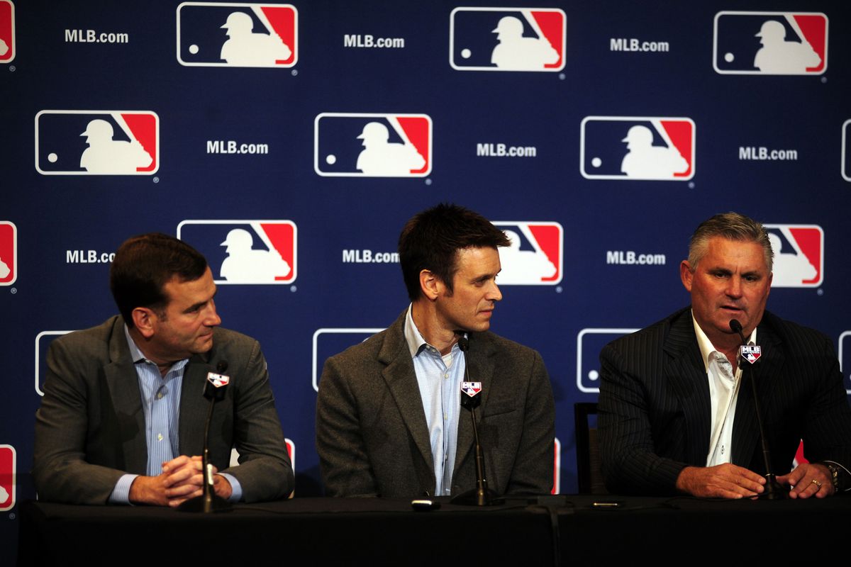 Chicago White Sox general manager Rick Hahn (left), and Los Angeles Angels general manager Jerry Dipoto (center), and Arizona Diamondbacks general manager Kevin Towers discuss their three-way trade during the 2013 MLB Winter Meetings.