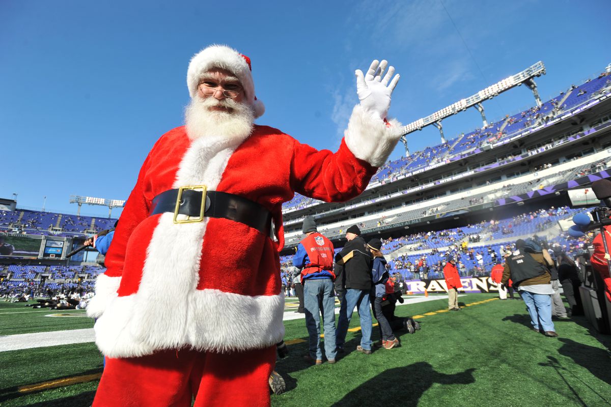 Santa Claus walks on the field before the game between the Baltimore Ravens and the New Orleans Saints at M&amp;T Bank Stadium on December 19, 2010 in Baltimore, Maryland. The Ravens defeated the Saints 30-24.