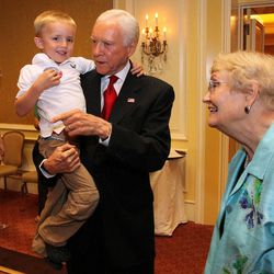 U.S. Sen. Orrin Hatch, R-Utah, talks with his great grandson, Jonathan Morgan, as his wife Elaine, right, watches at an election party, Tuesday, June 26, 2012, in Salt Lake City.