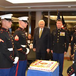 Elder L. Tom Perry, center at left, escorted by Capt. Joseph R. Thiel, center right, participates in a cake-cutting ceremony at the 238th Marine Corps Birthday Ball on Nov. 9, 2013, in Salt Lake City.