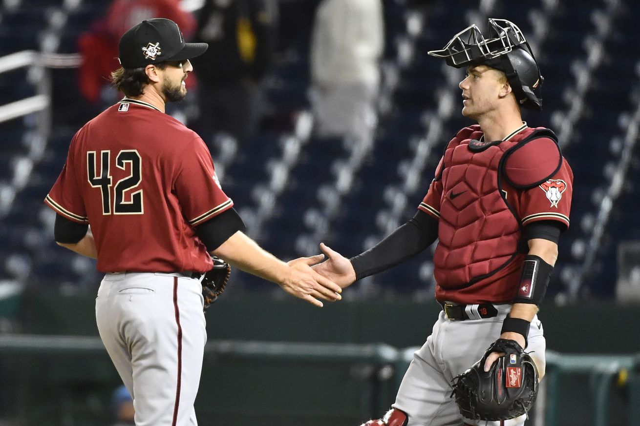  Arizona Diamondbacks relief pitcher Stefan Crichton is congratulated by Carson Kelly after recording the final out against the Washington Nationals at Nationals Park.