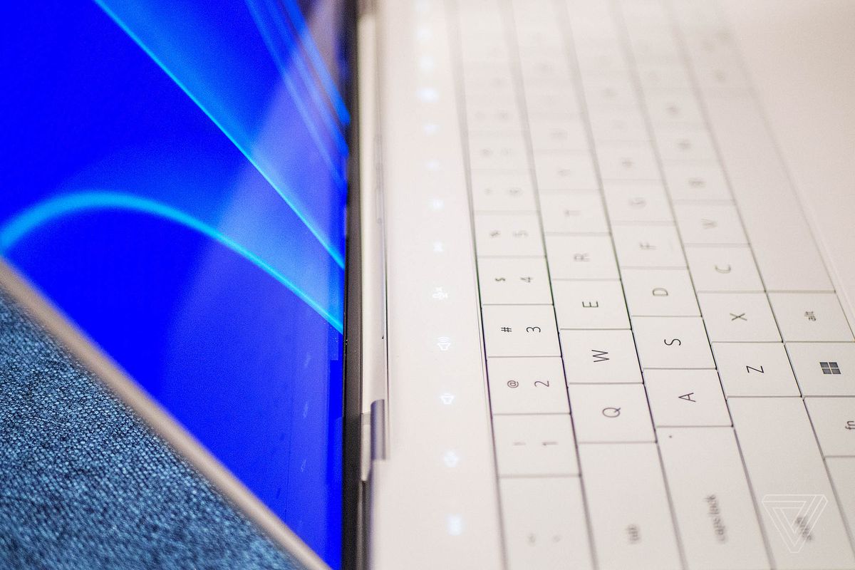 The Dell XPS 13 Plus capacitive function row illuminated, seen from the left side close up.