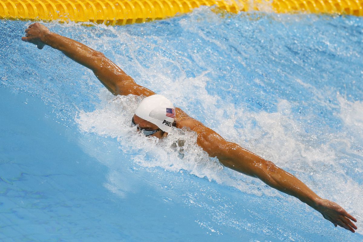 Aug 1, 2012; London, United Kingdom; Michael Phelps (USA) swims in the men's 200m individual medley heat during the London 2012 Olympic Games at Aquatics Centre. Mandatory Credit: Rob Schumacher-USA TODAY Sports