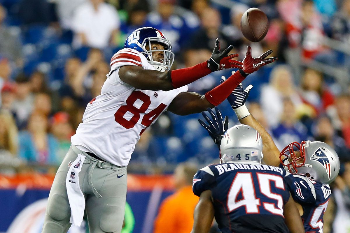 Larry Donnell hauls in a pass during a 2013 preseason game