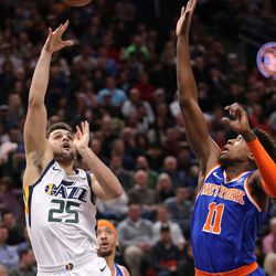 Utah Jazz guard Raul Neto (25) shoots over New York Knicks guard Frank Ntilikina (11) during a basketball game at the Vivint Smart Home Arena in Salt Lake City on Friday, Jan. 19, 2018.