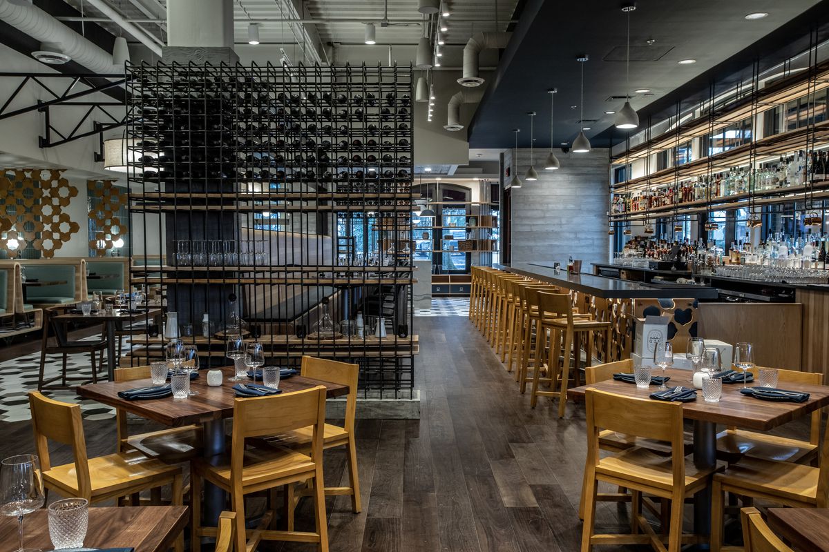 The design of the dining room and bar at Foundation Social Eatery in Alpharetta, GA, is similar in layout to that of the Roswell location. 