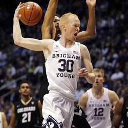 Brigham Young Cougars guard TJ Haws (30) makes a behind the back pass against Colorado during an NCAA basketball game in Provo on Saturday, Dec. 10, 2016.