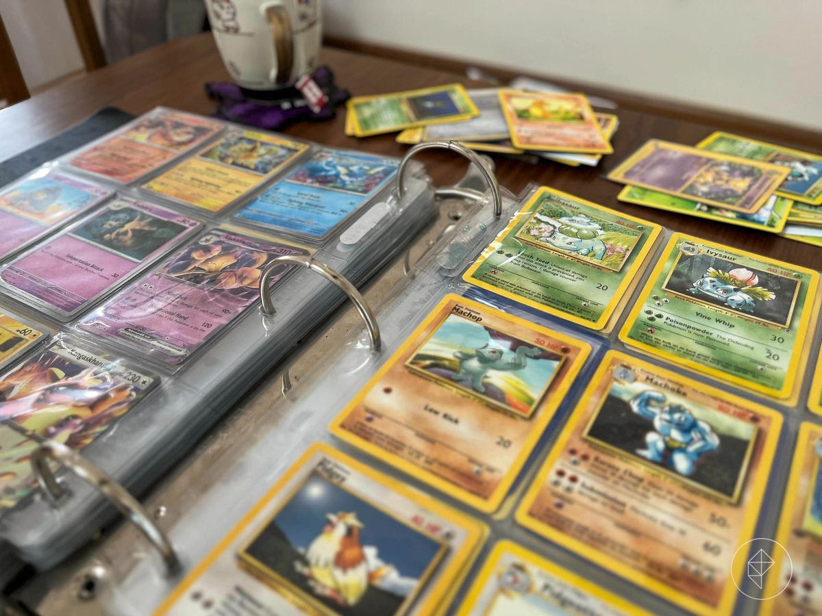 An photo of two pages of a three-ring binder open with Pokémon cards. It shows cards from the Scarlet &amp; Violet—151 set alongside other older cards.
