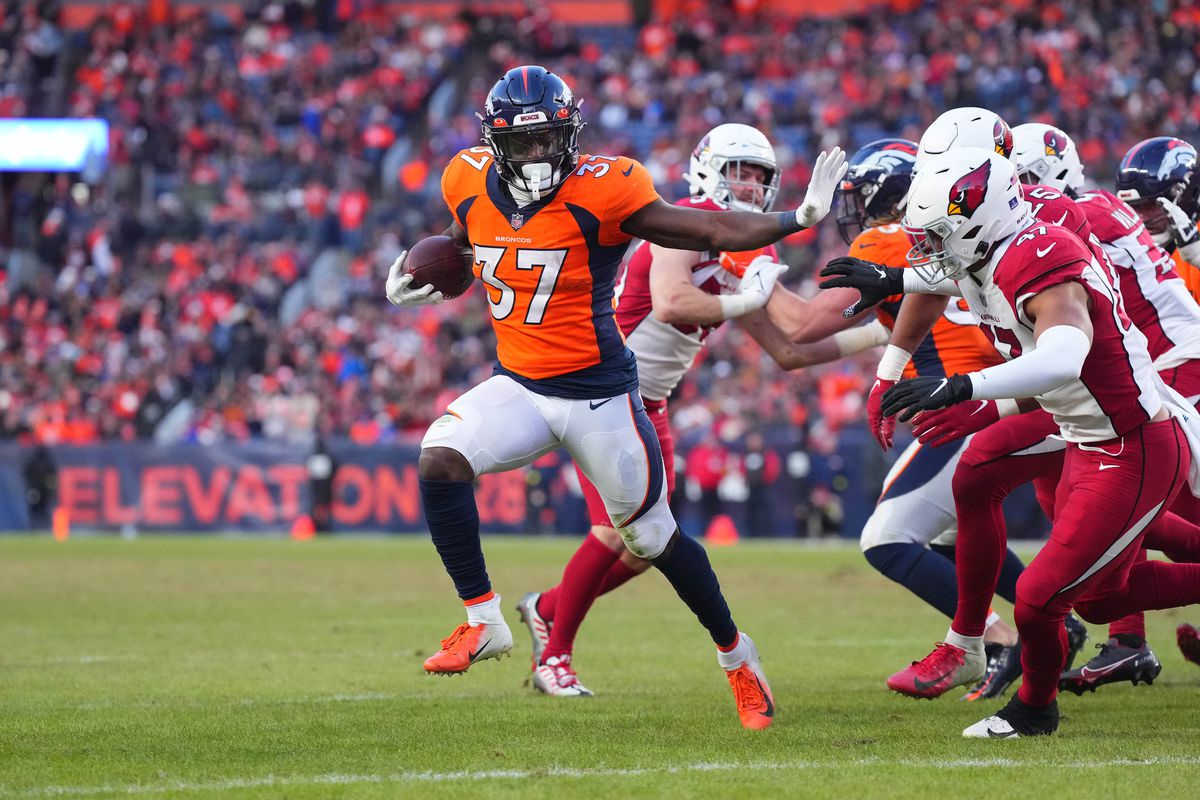 Denver Broncos running back Marlon Mack (37) carries the ball for a touchdown past Arizona Cardinals linebacker Ezekiel Turner (47) in the second half at Empower Field at Mile High.&nbsp;