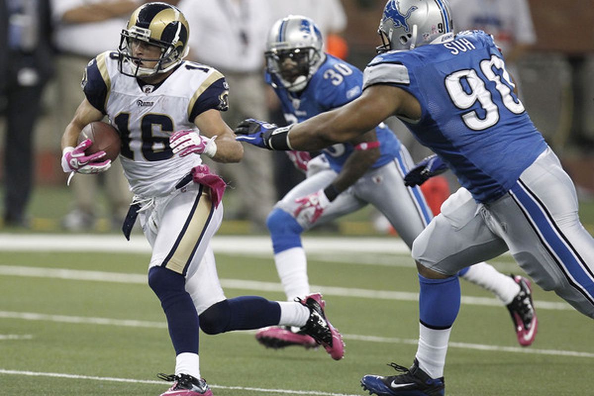 Danny Amendola #16 of the St. Louis Rams tries to outrun the tackle of Ndamukong Suh #90 of the Detroit Lions.