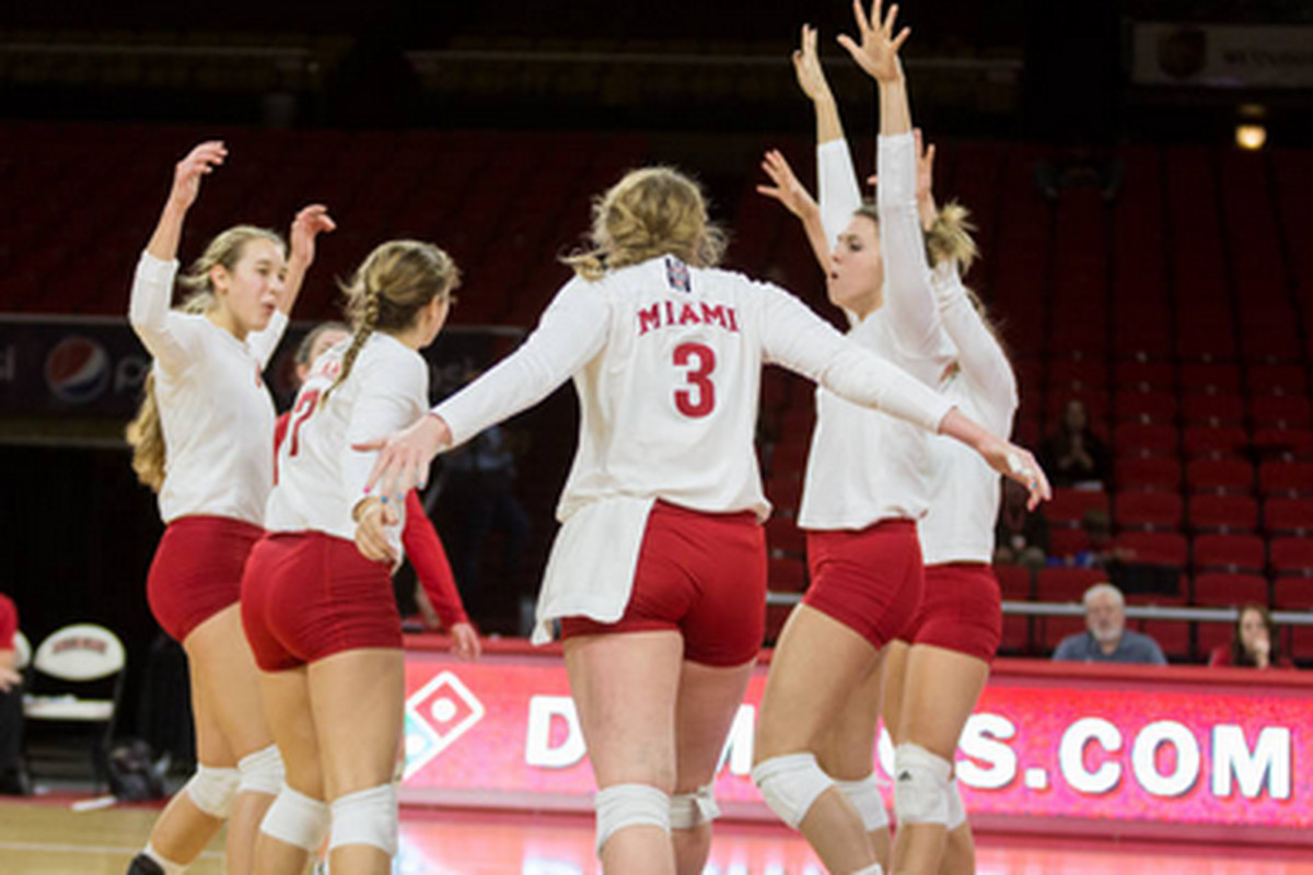 The Miami Redhawks Volleyball team celebrates a point in their semifinal victory over Northern Illinois in the 2014 MAC Volleyball tournament.