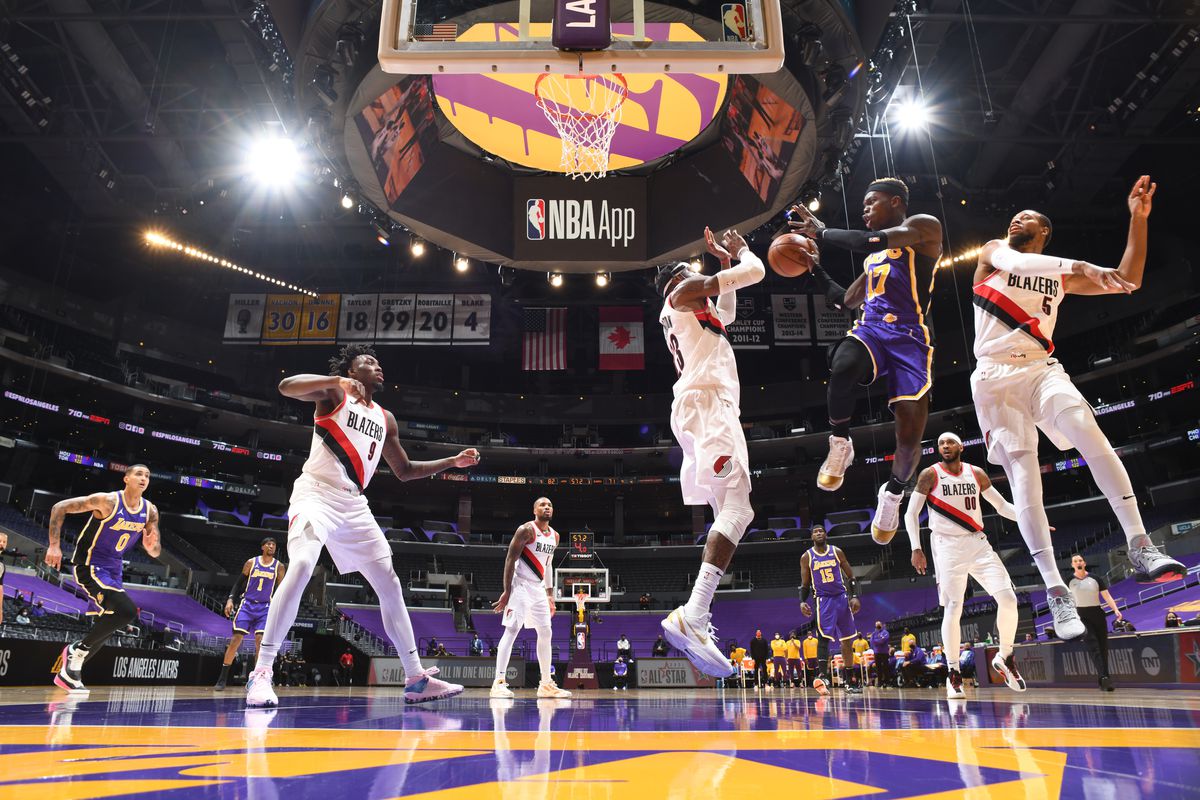Dennis Schroder #17 of the Los Angeles Lakers passes the ball during the game against the Portland Trail Blazers on February 26, 2021 at STAPLES Center in Los Angeles, California.