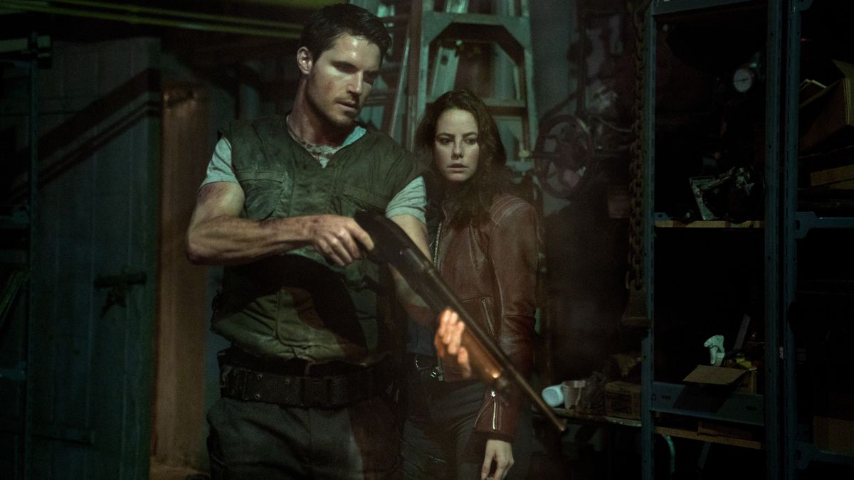 Robbie Amell and Kaya Scodelario in Screen Gems' Resident Evil: Welcome to Raccoon City.