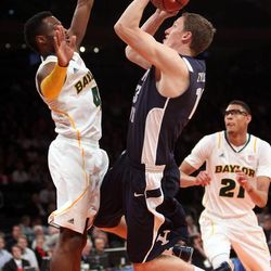 Brigham Young Cougars guard Brock Zylstra (13) tries to shoot over Baylor Bears guard Gary Franklin (4) during the NIT Final Four in New York City Tuesday, April 2, 2013. BYU lost 76-70.