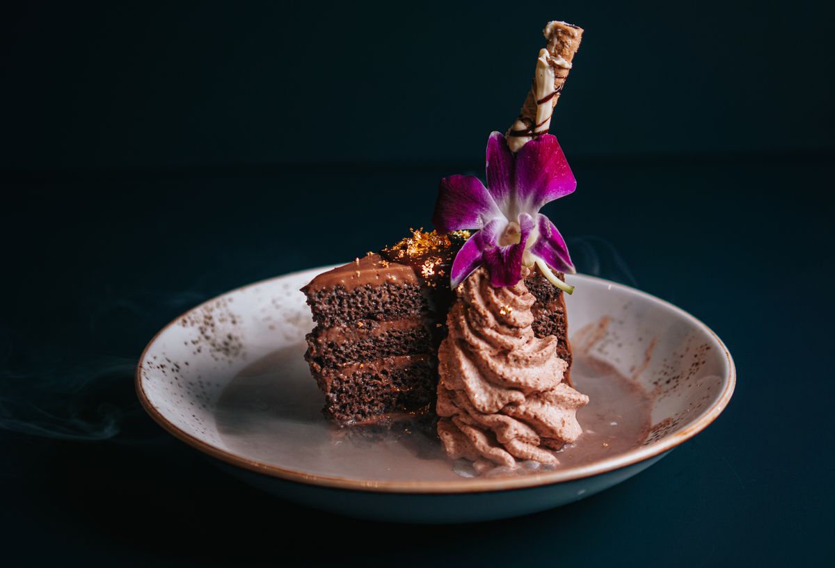 Rosland’s three-layer Chef C’s Chocolate Shock cake, with a side of mousse topped with a flower.