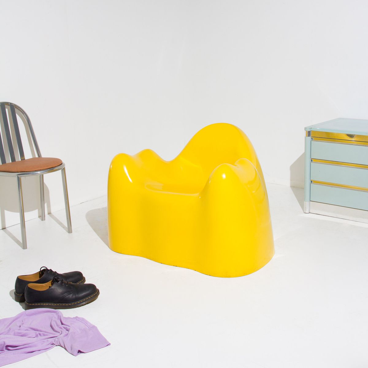 A molded plastic yellow chair