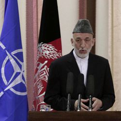 Afghan President Hamid Karzai speaks during a ceremony at military academy on the outskirts of Kabul, Afghanistan, Tuesday, June 18, 2013. Karzai announced at the ceremony that his country's armed forces are taking over the lead for security nationwide from the U.S.-led NATO coalition. 