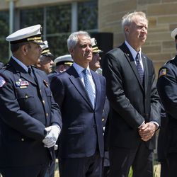 Chicago Fire Commissioner Jose Santiago (left), Mayor Rahm Emanuel (center) and Gov. Bruce Rauner line up as pallbearers carry out the casket for Juan Bucio at St. Rita of Cascia High School, Monday, June 4, 2018. Bucio, a Chicago Fire Department diver, died on Memorial Day while conducting a search in the Chicago River. | Ashlee Rezin/Sun-Times