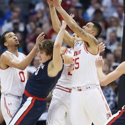 Utah Utes forward Kyle Kuzma (35) fights for a rebound with Gonzaga Bulldogs forward Kyle Wiltjer (33)  during the NCAA basketball tournament second round in Denver,  Saturday, March 19, 2016. 
