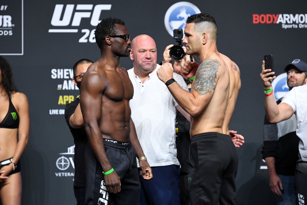 (L-R) Uriah Hall of Jamaica and Chris Weidman face off during the ceremonial UFC 261 weigh-in at VyStar Veterans Memorial Arena on April 23, 2021 in Jacksonville, Florida.