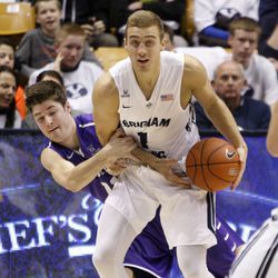 Brigham Young Cougars guard Chase Fischer (1) holds the ball as Bobby Sharp tries to steal it as Brigham Young University plays Portland in NCAA men's basketball Monday, Dec. 29, 2014, in Provo.  
