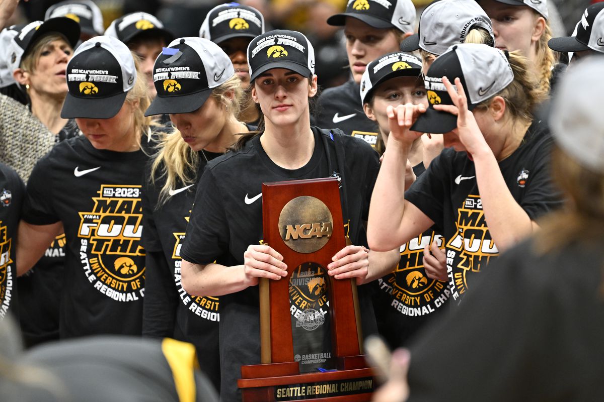 Caitlin Clark of the Iowa Hawkeyes celebrates after defeating the Louisville Cardinals 97-83 in the Elite Eight round of the NCAA Women’s Basketball Tournament at Climate Pledge Arena on March 26, 2023 in Seattle, Washington.