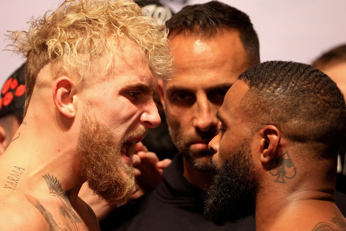 Jake Paul and Tyron Woodley poses during a weigh in at the Hard Rock Hotel and Casino ahead of this weekends fight on December 17, 2021 in Tampa, Florida.
