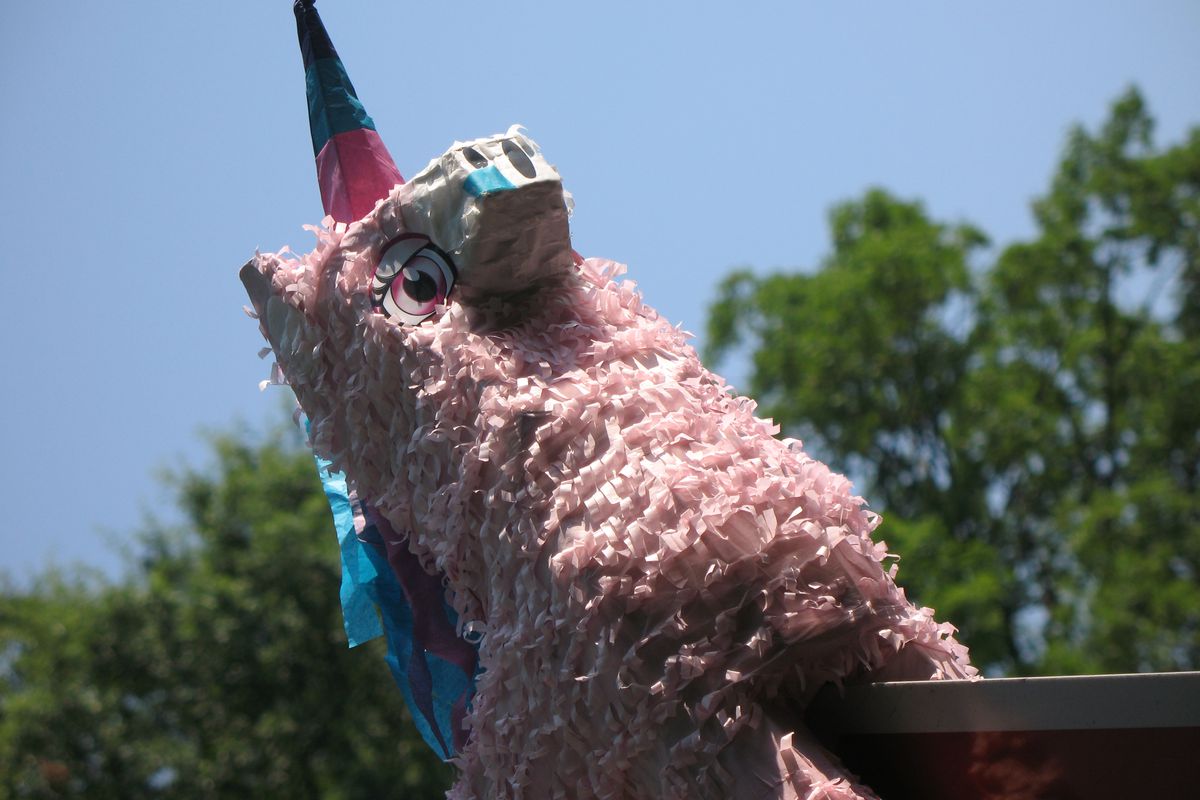 pink unicorn pinata looking ready to jump 