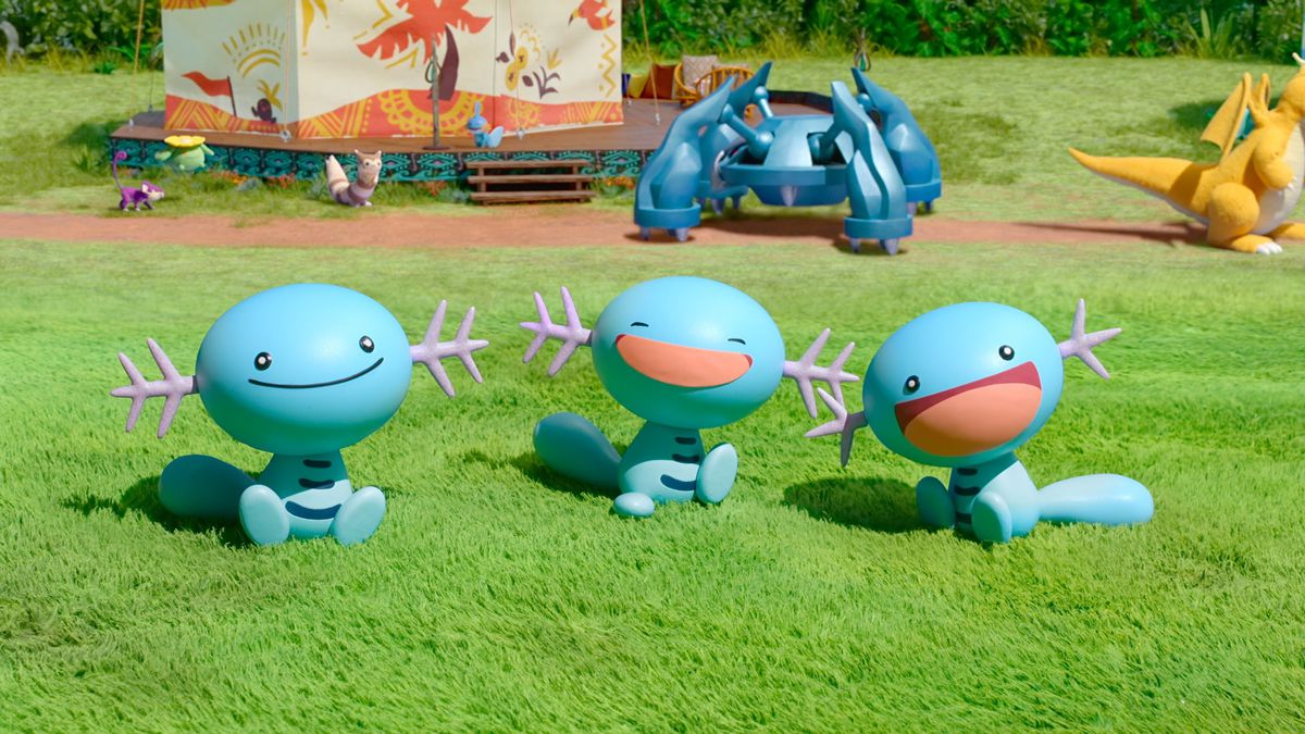 A trio of Woopers smiling. A Metagross is in the background