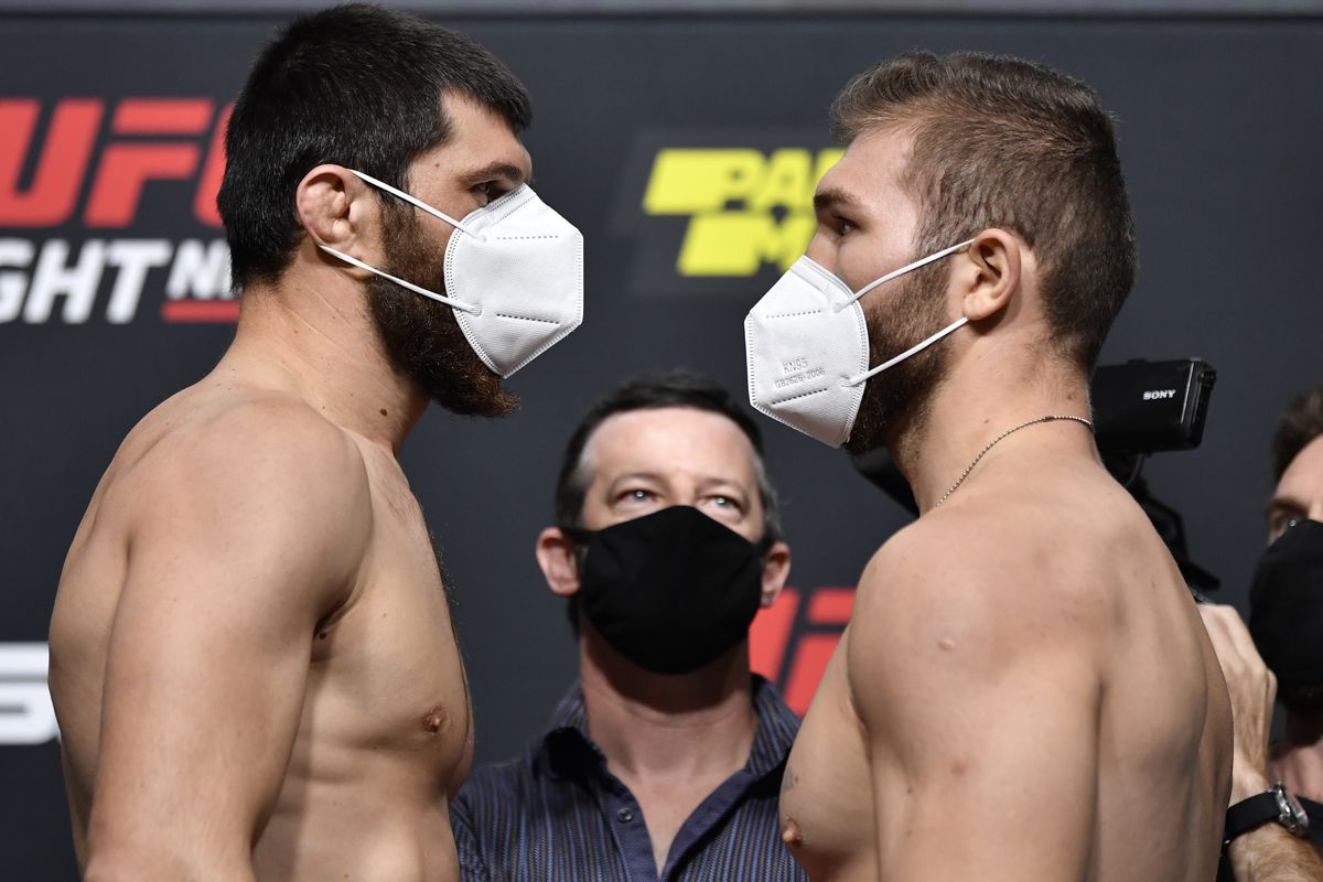 Opponents Magomed Ankalaev of Russia and Ion Cutelaba of Moldova face off during the UFC Fight Night weigh-in at UFC APEX on August 28, 2020 in Las Vegas, Nevada.