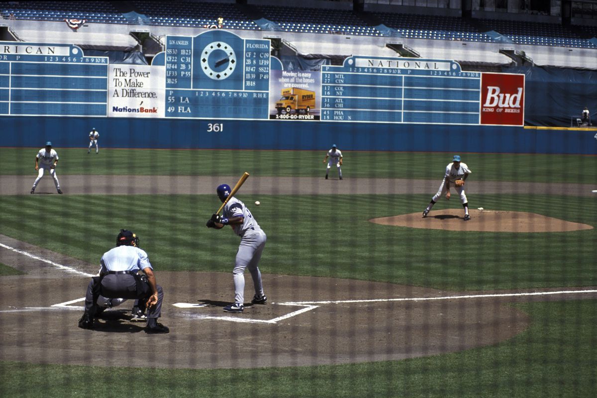 Florida Marlins Charlie Hough in action, pitching 1st franchise pitch during inaugural game vs Los Angeles Dodgers Jose Offerman, View of Joe Robbie Stadium, Miami, FL 4/4/1993