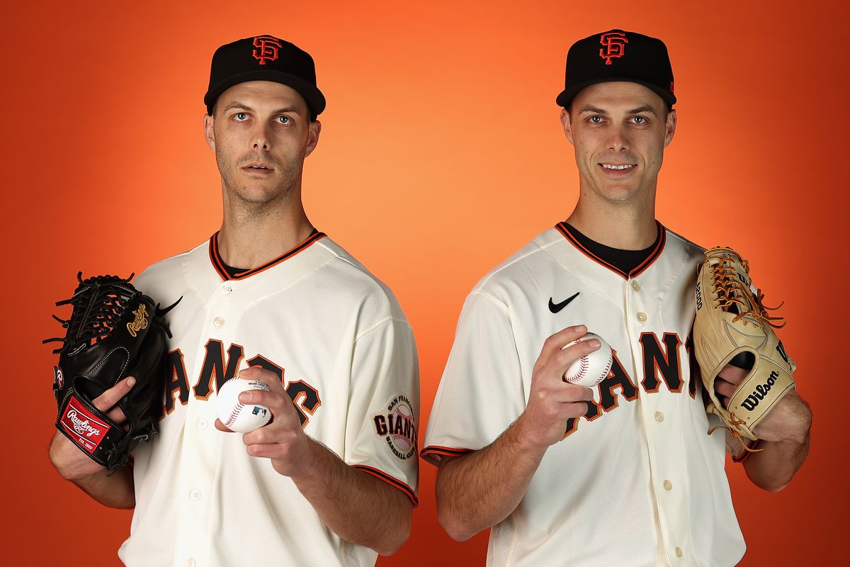 Tyler and Taylor Rogers posing, holding baseballs