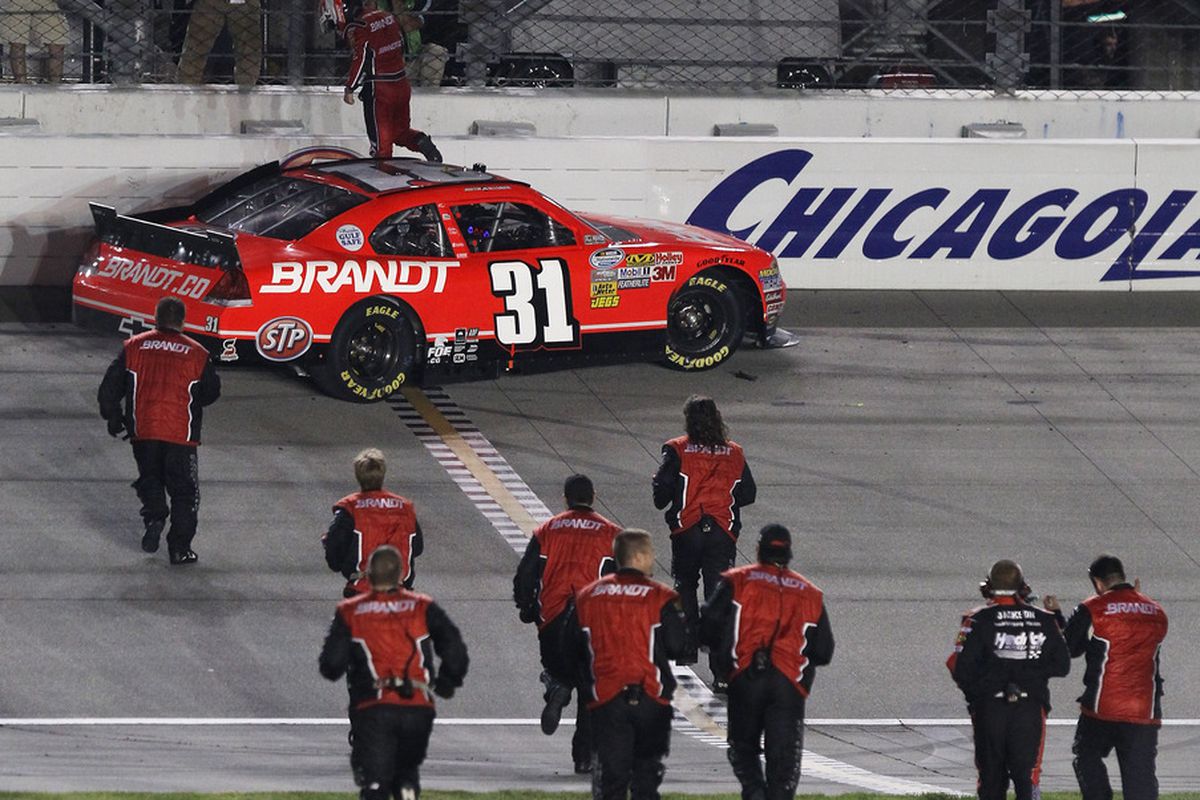 Justin Allgaier's crew runs to celebrate with its driver (Photo: Jonathan Daniel/Getty Images for NASCAR)