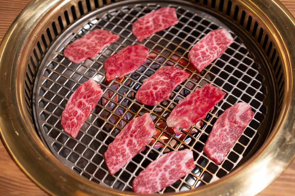 Wagyu placed on an open grate Japanese barbecue grill at iWagyu.