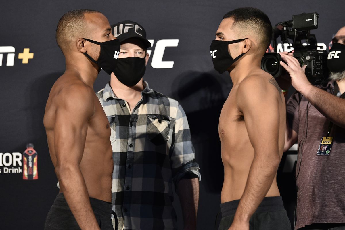 In this handout image provided by UFC, opponents Jordan Espinosa and Mark De La Rosa face off during the UFC Fight Night weigh-in at UFC APEX on June 12, 2020 in Las Vegas, Nevada.