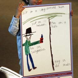 Atticus Teter, 6, from Rowland Hall, wins the prize for the best drawing showing what clothing to wear in the sun. Teter wass one of 27 finalists for the SunWise with SHADE poster contest, sponsored by the U.S. Environmental Protection Agency. Winners were honored Friday, April 6, 2012, at the Huntsman Cancer Institute.