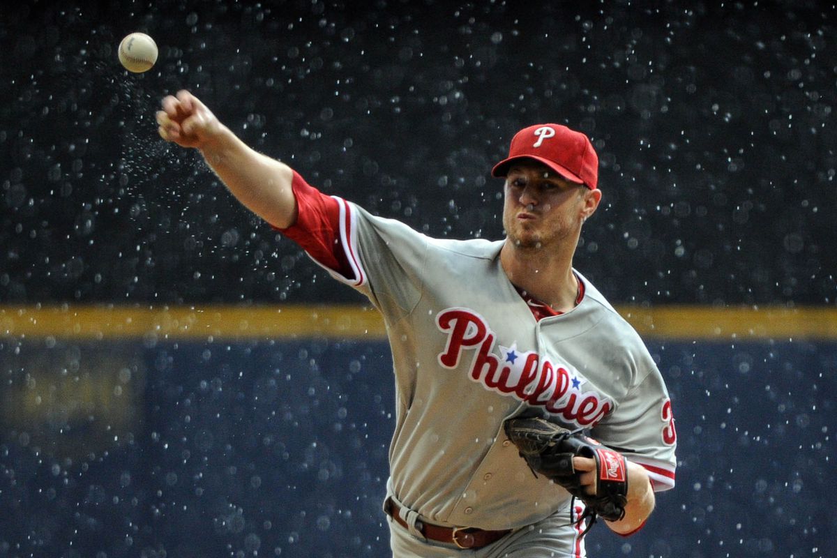 Aug 19, 2012; Milwaukee, WI, USA;   Philadelphia Phillies pitcher Kyle Kendrick (38) pitches in the rain against the Milwaukee Brewers at Miller Park.  Mandatory Credit: Benny Sieu-US PRESSWIRE