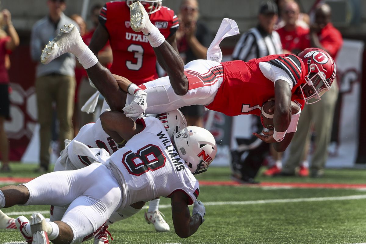 Utah Utes quarterback Tyler Huntley (1) dives over the Northern Illinois Huskies defense and into the end zone for a touchdown during first half action at Rice-Eccles Stadium in Salt Lake City on Saturday, Sept. 7, 2019.