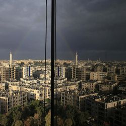 A rainbow appears after a heavy rain over Aleppo, Syria, Saturday, Dec. 3, 2016. 