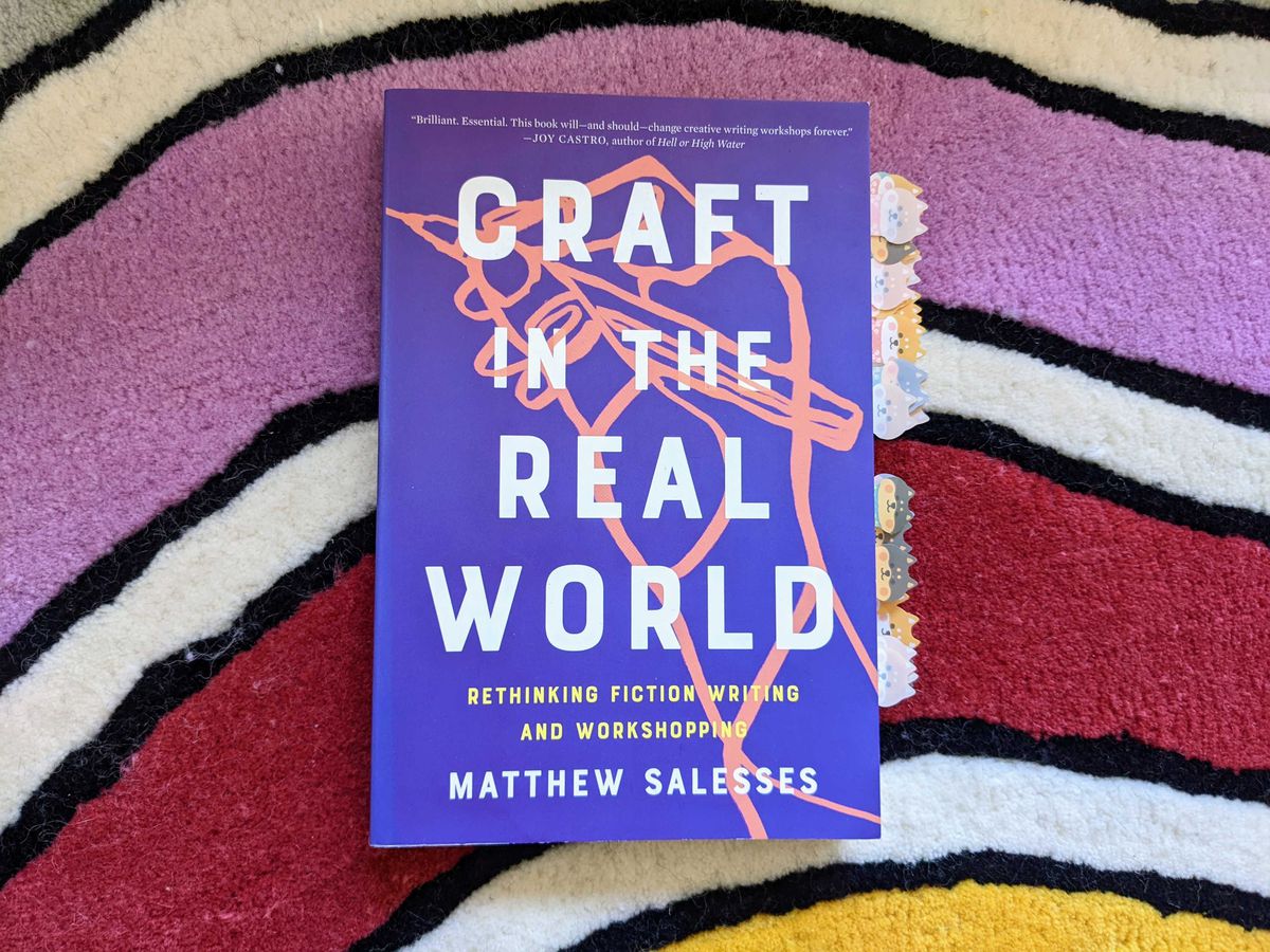 An annotated copy of Craft in the Real World, photographed atop a multicolored rug
